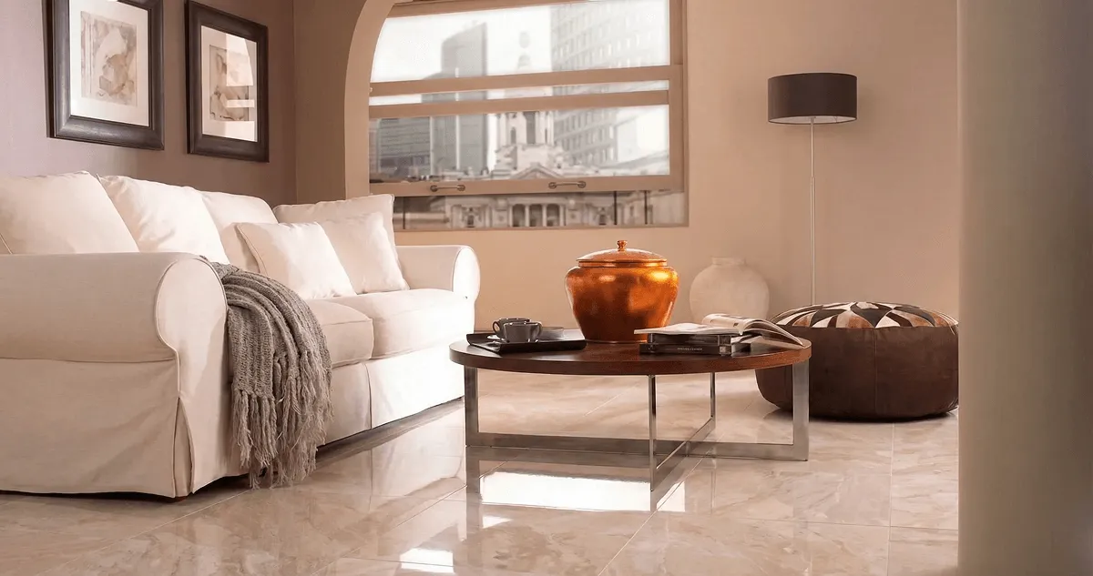 Modern living room with professionally installed marble flooring, a beige sofa, coffee table in Worcester, MA